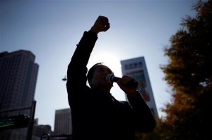 In this Nov. 14, 2014 photo, North Korean defector Kim Seong-Min, the head of Free North Korea Radio, shouts slogans during a rally to improve human rights condition in North Korea, in Seoul, South Korea. AP
