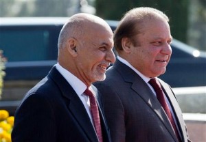 Pakistan's Prime Minister Nawaz Sharif, right, proceeds with visiting Afghan President Asharf Ghani to review a guard of honor at the prime minister house in Islamabad, Pakistan, Saturday, Nov. 15, 2014. AP.