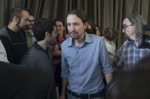 In this May 30, 2014 file photo, Pablo Iglesias, the leader of the leftist Podemos (We Can) party, centre, leaves a news conference in Madrid, Spain. AP