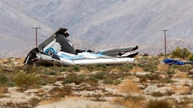 Wreckage lies near the site where a Virgin Galactic space tourism rocket, SpaceShipTwo, exploded and crashed in Mojave, Calif. Friday, Oct. 31, 2014. The explosion killed a pilot aboard and seriously injured another while scattering wreckage in Southern California's Mojave Desert, witnesses and officials said. (AP Photo/Ringo H.W. Chiu)