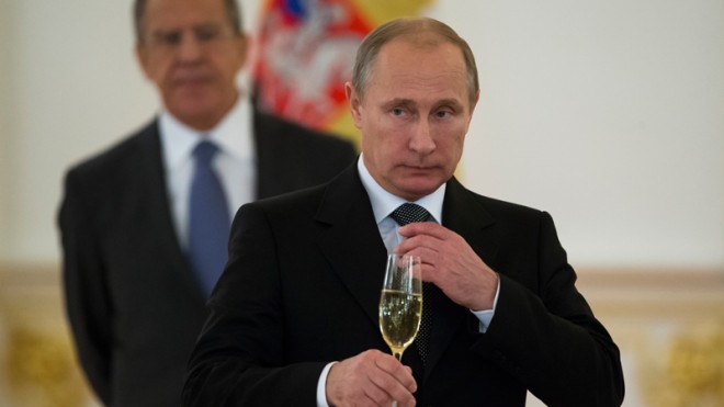  In this file photo taken Wednesday, Nov. 19, 2014, Russian President Vladimir Putin prepare to toast with ambassadors in the Alexander Hall after a ceremony of presentation of credentials by foreign ambassadors in the Grand Kremlin Palace in Moscow, Russia. Vladimir Putin says he will not remain Russia’s president for life, but will step down in line with the Russian constitution no later than 2024. Staying beyond that would be “detrimental for the country and I don’t need this,” he said in an interview with the Tass news agency released Sunday.(AP Photo/Alexander Zemlianichenko, file)
