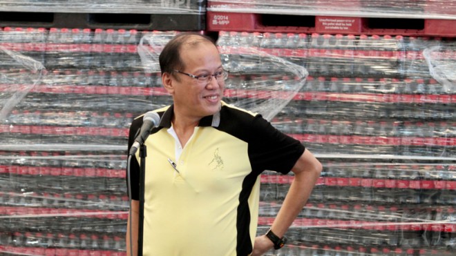 President Aquino prepares to answer questions from reporters during an ambush interview at the inauguration of the $95-million plant expansion of Coca Cola Femsa Philippines in Calamba City on Monday. After being asked by reporters about the criticisms hurled by Vice President Binay against his administration, Aquino said Binay was free to leave "if he thinks we are going in the wrong direction."  INQUIRER PHOTO/GRIG C. MONTEGRANDE