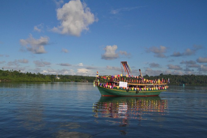 A BOAT festooned with colorful decorations joins the fluvial parade from Bongao to Simunul in Tawi-Tawi province at the start of festivities for the 25th anniversary of the Autonomous Region in Muslim Mindanao. 