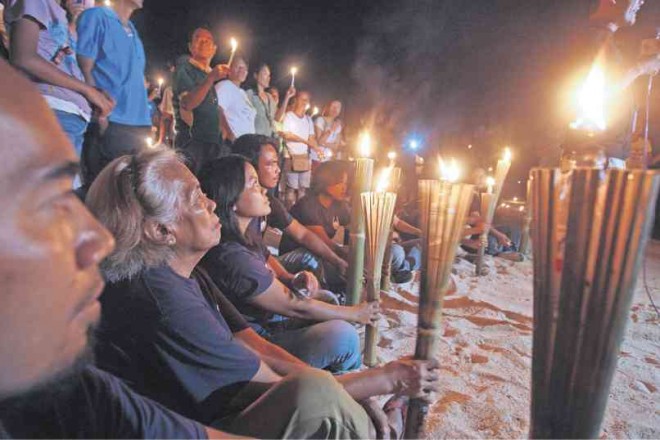 RESIDENTS of Barangay Sta. Fe, Bantayan Island, held a torch procession to remember their dead due to Supertyphoon “Yolanda.” TONEE DESPOJO/Cebu Daily News 
