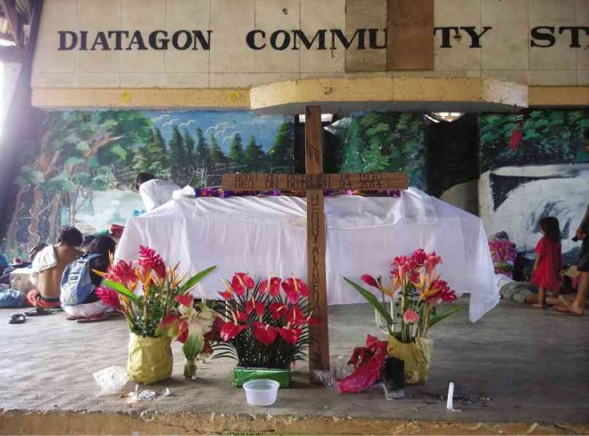 THE COFFIN of slain Manobo tribal leader Henry Alameda is displayed at the Diatagon barangay (village) hall where thousands of displaced residents sought temporary shelter.  CHRIS V. PANGANIBAN/INQUIRER MINDANAO