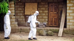 In this file photo taken on Tuesday, Oct. 21, 2014, a healthcare worker in protective gear sprays disinfectant around the house of a person suspected to have the Ebola virus in Port Loko Community, situated on the outskirts of Freetown, Sierra Leone. AP 