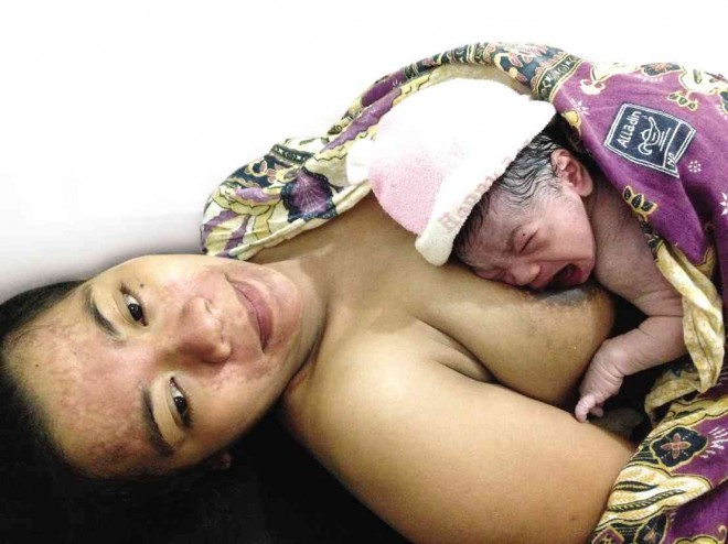 GINA Avenido with her newborn John Fritch      NICO ALCONABA  