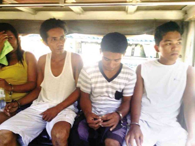 THE TEXT SCAM suspects in a police vehicle on the way to the Prosecutor’s Office of Digos City. ELDIE AGUIRRE/INQUIRER MINDANAO 