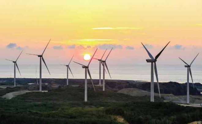 DAWN FOR GREEN ENERGY THE WINDMILLS in the wind farm of the Energy Development Corp. (EDC) in Burgos, Ilocos Norte, that is now generating up to 150 megawatts of clean electricity CONTRIBUTED PHOTO 