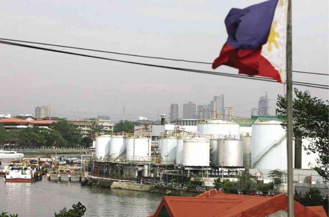 WHAT LIES BENEATH Operational since 1914 and set for removal next year, the Pandacan oil depot may require a long massive cleanup to be declared environmentally safe for new developments. FILE PHOTO