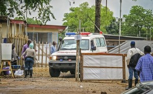 In this Sunday, Aug. 10, 2014 file photo, an ambulance leaves the Ebola isolation unit carrying the bodies of Ebola victims that are highly contagious to a burial site, at the Kenema Government Hospital situated in the Eastern Province around 300 km, (186 miles), from the capital city of Freetown in Kenema, Sierra Leone .  AP