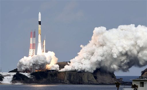 An H2-A rocket carrying space explorer Hayabusa2, lifts off from a launching pad at Tanegashima Space Center in Kagoshima, southern Japan, Wednesday, Dec. 3, 2014.  AP