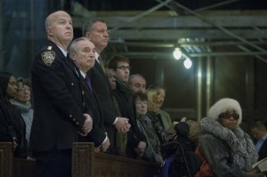 From left, NYPD's Chief of Department James O'Neill, NYPD Commissioner Bill Bratton, and New York City Mayor Bill de Blasio, attend Mass at St. Patrick's Cathedral, Sunday, Dec. 21, 2014, in New York. The previous day an armed man walked up to two New York Police Department officers sitting inside a patrol car and opened fire, killing both before running into a nearby subway station and committing suicide, police said. AP PHOTO/JOHN MINCHILLO