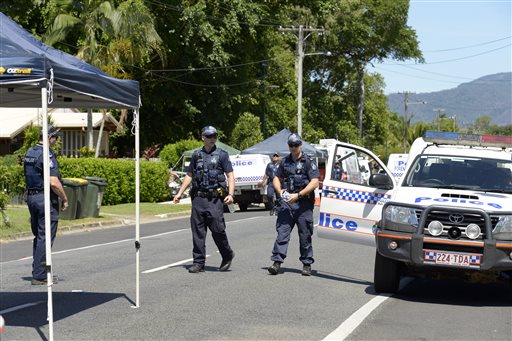 Police patrol near a house where eight children have been found dead in a Cairns suburb in far north Queensland, Australia, Friday Dec 19, 2014. Queensland state police said they were called to the home in the Cairns suburb of Manoora on Friday morning after receiving a report of a woman with serious injuries. When police got to the house, they found the bodies of the children inside, ranging in age from 18 months to 15 years. AP 