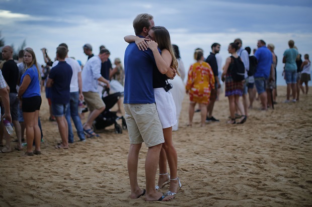 A couple embrace during a commemoration ceremony for the Swedish victims of the Asian tsunami, Friday, Dec. 26, 2014 in Khao Lak, Thailand. Dec. 26 marks the 10th anniversary of one of the deadliest natural disasters in world history: a tsunami, triggered by a massive earthquake off the Indonesian coast, that left more than 230,000 people dead in 14 countries and caused about $10 billion in damage. AP
