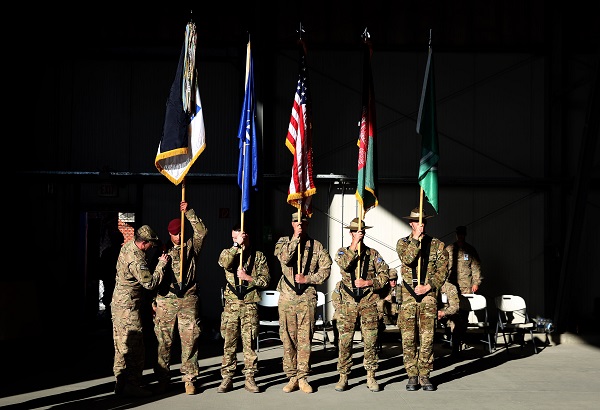 In this Dec. 8, 2014 file photo, International Security Assistance Forces honor guards take part in a flag-lowering ceremony in Kabul, Afghanistan. The U.S. and NATO ceremonially ended their combat mission in Afghanistan on Monday, 13 years after the Sept. 11 terror attacks sparked their invasion of the country to topple the Taliban-led government.  AP