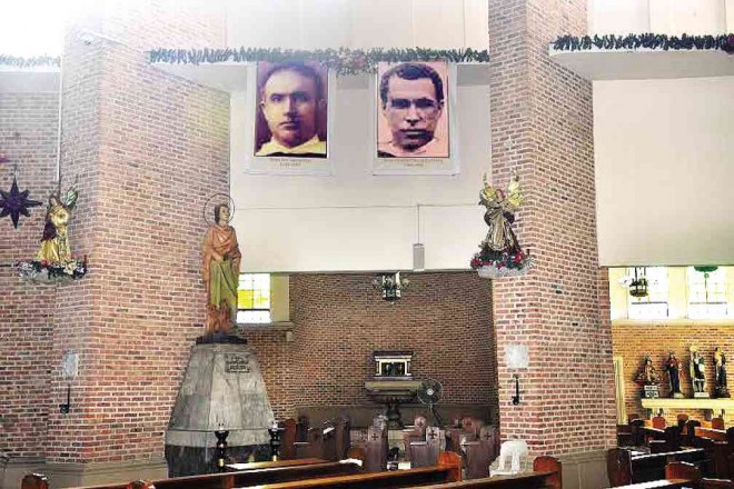 Enlarged photos of Blessed Jose Garcia Diaz and Beato Candido Fernandez Garcia are prominently hung inside the St. John the Evangelist Metropolitan Cathedral. Willie Lomibao/CONTRIBUTOR