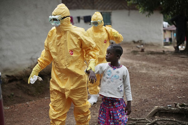This Sept. 30, 2014 file photo shows Nowa Paye, 9, as she is taken to an ambulance after showing signs of Ebola infection in the village of Freeman Reserve, about 30 miles north of Monrovia, Liberia. AP FILE PHOTO