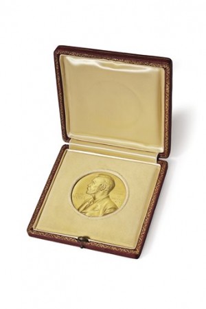 FILE - This undated photo provided by Christie's auction house shows James Watson’s 1962 Nobel Prize medal for his role in the discovery of the structure of DNA. On Thursday, Dec. 4, 2014, the medal sold at auction by Christie's for $4.7 million - a world auction record for any Nobel Prize. Watson made the 1953 discovery with Francis Crick and Maurice Wilkins. (AP Photo/Christie's, File)