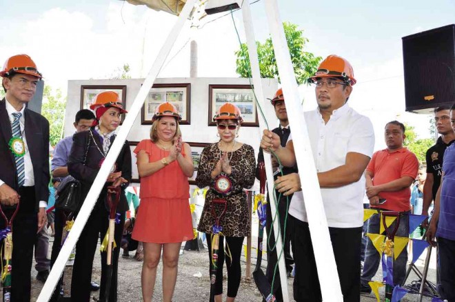 NUEVA ECIJA Governor Aurelio Umali (right), Palayan City Mayor Adrianne Mae Cuevas (third from left) and officials of a Malaysian firm, Alloy MTD, lead the groundbreaking of Palayan City Business Hub, which will host government and private offices. ARMAND GALANG/INQUIRER NORTHERN LUZON