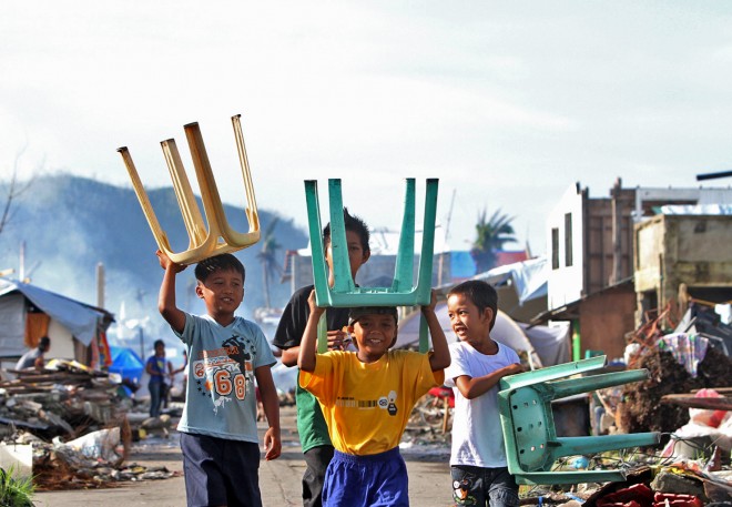 Smiling children in Yolanda-devastated areas. #InquirerSeven Most Heartwarming stories of 2014.