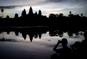This photo taken on Nov. 8, 2014, shows tourists taking photos of the Angkor Wat temple complex at sunrise in Cambodia's Angkor National Park, Siem Reap province. AFP