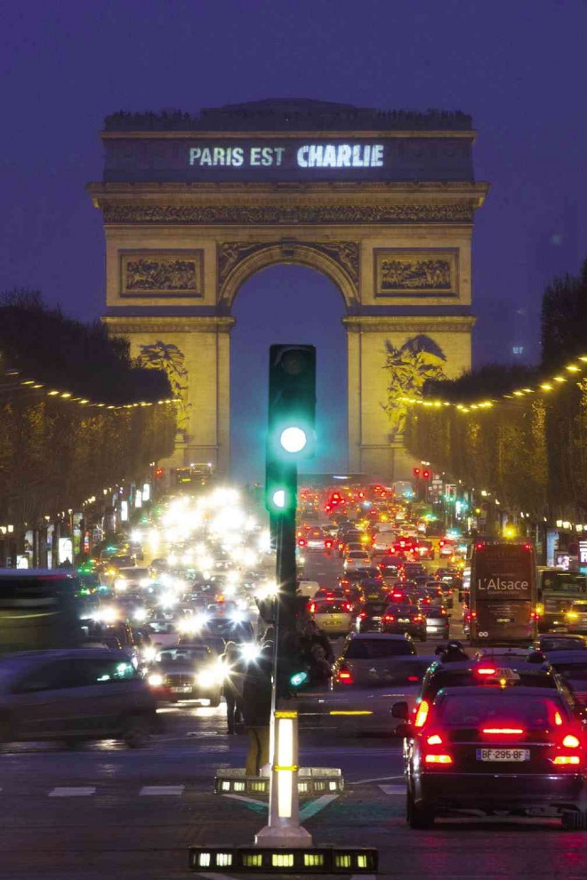 SOLIDARITY  A sign on the Arc de Triomphe reads “Paris is Charlie” in solidarity with the victims of the shooting at the newspaper Charlie Hebdo in Paris.  AP