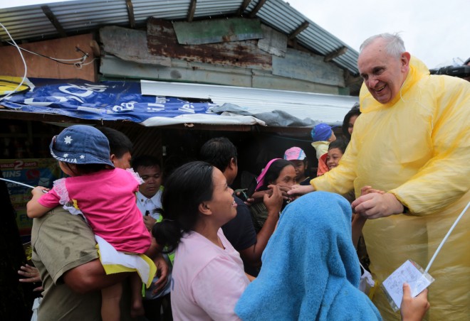 Pope Francis visits families of Typhoon Yolanda victims in one of the areas in Palo, Leyte Saturday, January 17, 2015.  (Photo by Benhur Arcayan/Malacanang Photo Bureau)