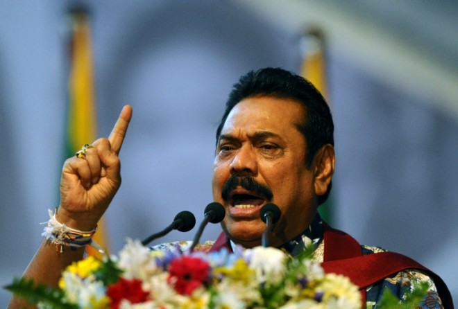 Sri Lanka President Mahinda Rajapaksa addresses to supporters as he attends an election rally in the Colombo suburb of Piliyandala on January 5. AFP PHOTO