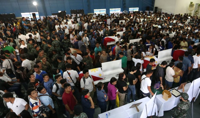 The 42 of the 44 bodies of the slain SAF troopers inside the Camp BAgong Diwa multi-purpose hall. JOAN BONDOC/INQUIRER.net