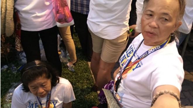 Aurora Antolin, 76, (left) was among those who weren't able to enter the Mall of Asia Arena despite owning a ticket to see Pope Francis on Friday. Mark Giongco