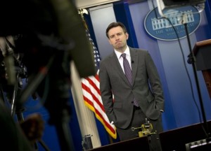 White House press secretary Josh Earnest waits to do a television interview with Fox News in the Brady Press Briefing Room of the White House in Washington, Wednesday, Jan. 7, 2015. President Barack Obama has condemn the shooting at the offices of Charlie Hebdo magazine in Paris that has reportedly killed 12 people. AP