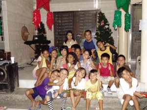 YOUNG readers are treated to a Christmas party. In back row are Librohan steward Teresa and her husband Manuel Ragasa Jr. Their daughter, Jay Andrea, is third from left in the second row.