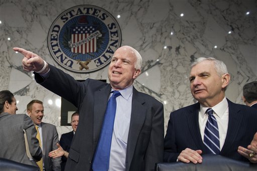 Senate Armed Services Committee Chairman Sen. John McCain, R-Ariz., left, talks to the committee's ranking member Sen. Jack Reed, D-R.I., on Capitol Hill in Washington, Wednesday, Jan. 21, 2015, prior to the start of the committee's hearing to examine global challenges and US national security strategy. AP