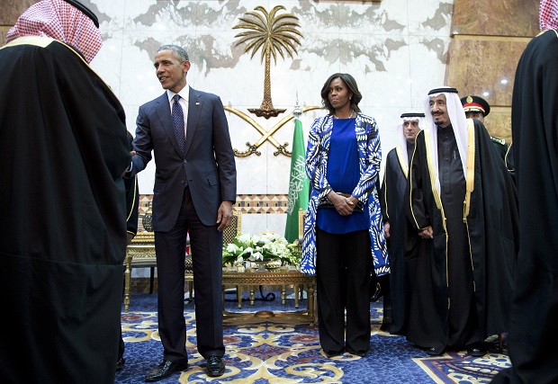 President Barack Obama and first lady Michelle Obama participate in a delegation receiving line with new Saudi Arabian King, Salman bin Abdul Aziz, fith left, in Riyadh, Saudi Arabia, Tuesday, Jan. 27, 2015. The president and first lady have come to expresses their condolences on the death of the late Saudi Arabian King Abdullah bin Abdulaziz al-Saud. (AP Photo/Carolyn Kaster)