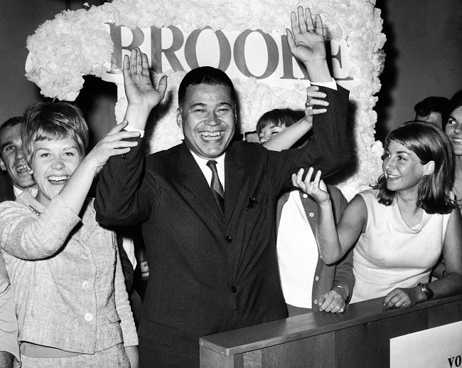 This Sept. 14, 1966, file photo shows Edward W. Brooke joining campaign workers in celebration, in Boston, after winning the Republican nomination for U.S. Senate. Brooke, the first black to win popular election to the Senate, has died. He was 95. Ralph Neas, a former aide, said Brooke died Saturday, Jan. 3, 2015, of natural causes at his Coral Gables, Fla, home. AP