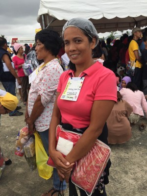 Celine Bondoc braved the rain just wearing a shower cap if only to attend Pope Francis' mass.
