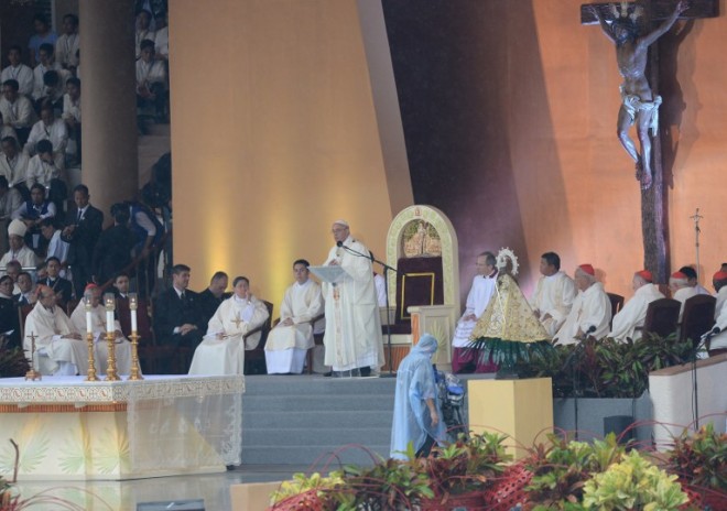 Pope Francis speaks during his visit’s culminating Mass at Rizal Park in Manila on Sunday, Jan. 18, 2015.  AFP PHOTO/TED ALJIBE