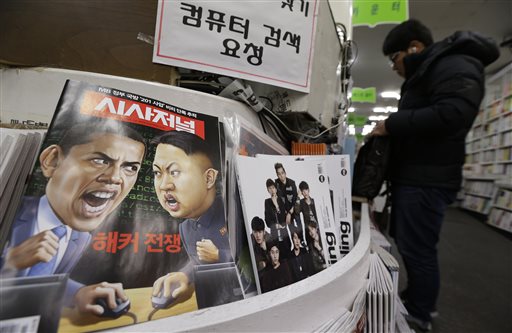 A magazine with cartoons of U.S. President Barack Obama, left, and North Korean leader Kim Jong Un is displayed at a book store in Seoul, South Korea, Saturday, Jan. 3, 2015. AP FILE PHOTO