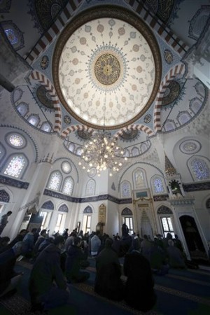 Muslims residing in Japan offer Friday prayers at Tokyo Camii, the largest mosque in Japan, in Tokyo, Friday, Jan. 23, 2015. The deadline for paying ransom for two Japanese hostages held by the Islamic State group was fast approaching early Friday with no signs of a breakthrough. (AP Photo/Eugene Hoshiko)