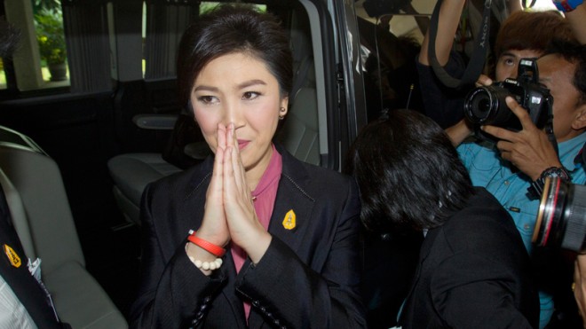 Thailand's former Prime Minister Yingluck Shinawatra leaves parliament in Bangkok, Thailand, Friday, Jan. 9, 2015. Thailand's military-appointed legislature began impeachment hearings Friday against Yingluck, a move analysts say is aimed at ensuring the ousted leader stays out of politics for the foreseeable future. (AP Photo/Sakchai Lalit)