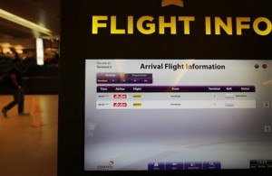 An electronic kiosk providing flight information shows the status for AirAsia flight QZ8501 from Surabaya to Singapore as "Ask Airline" Sunday, Dec. 28, 2014 at the Changi International Airport in Singapore. An AirAsia plane with 162 people on board lost contact with ground control on Sunday while flying over the Java Sea after taking off from a provincial city in Indonesia for Singapore. The two countries immediately launched a search and rescue operation but there was no word on the plane's whereabouts more than six hours after it went missing. (AP Photo/Wong Maye-E)