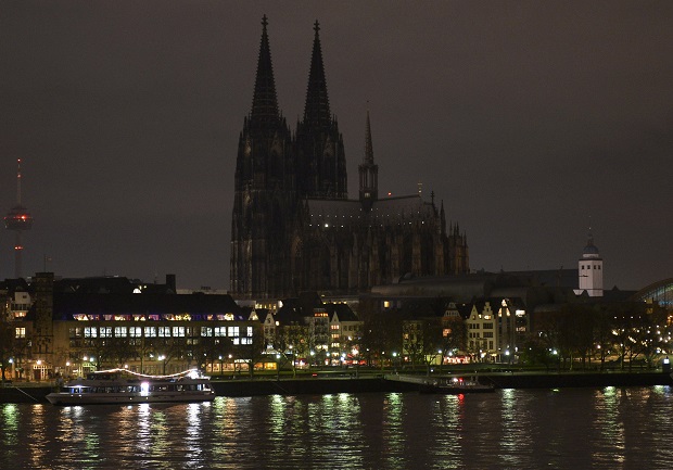 The illumination of the world famous Cologne cathedral goes out during a rally called 'Patriotic Europeans against the Islamization of the West' (PEGIDA) in Cologne, Germany, Monday evening, Jan. 5, 2015. The church wants to protest against intolerance of the anti Islamic movement, that came up in many German cities. (AP Photo/Martin Meissner)