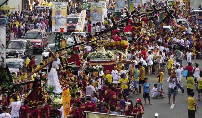 REPLICAS of the Black Nazarene are paraded in the streets of Manila on Wednesday as a prelude to tomorrow’s “traslacion,” a mammoth procession rooted in the 17th century. Alexis Corpuz