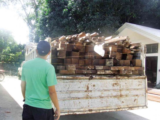 PART of the P7M-worth of illegal logs confiscated from a resort development project owned by a Norwegian national on Saturday. REDEMPTO ANDA/INQUIRER SOUTHERN LUZON