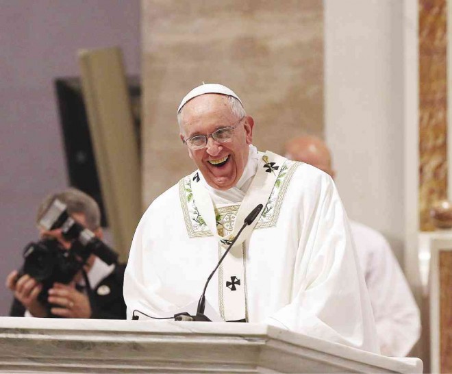 ‘DO YOU LOVE ME?’ Pope Francis lets out a hearty laugh during his homily at the first Mass he celebrated here at Manila Cathedral on Friday where the question from the Bible quoting Jesus who asked Peter if he loved Him, is met with a resounding “yes” by his enchanted audience . MARIANNE BERMUDEZ