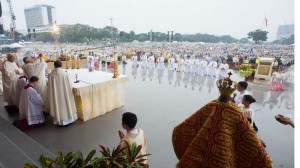 Pope Francis celebrates a Mass at Rizal Park, in Manila, Philippines, Sunday, Jan. 18, 2015. Millions filled Manila's main park and surrounding areas for Pope Francis' final Mass in the Philippines on Sunday, braving a steady rain to hear the pontiff's message of hope and consolation for the Southeast Asian country's most downtrodden and destitute. (AP Photo/L'Osservatore Romano, Pool)