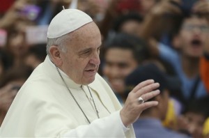 Pope Francis waves during the "Meeting with Families" at the University of Santo Tomas in Manila, Philippines on Sunday, Jan. 18, 2015. (AP Photo/Aaron Favila)