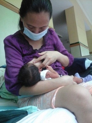 Miradel Torres and her two-month old son./Photo by Karapatan
