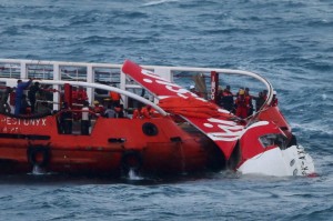In this Jan. 10, 2015 file photo, Indonesian search and rescue ship recovers the tail wreckage of AirAsia flight QZ8501 from the seabed south of Borneo island. AFP